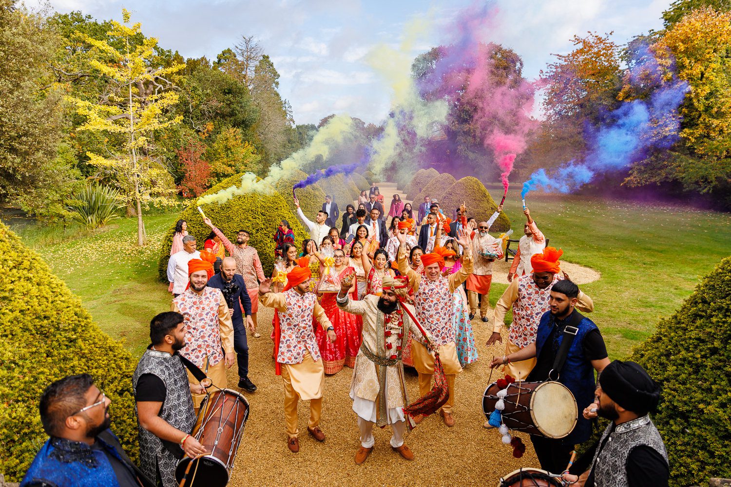 Asian wedding procession at Manor by the lake in Cheltenham