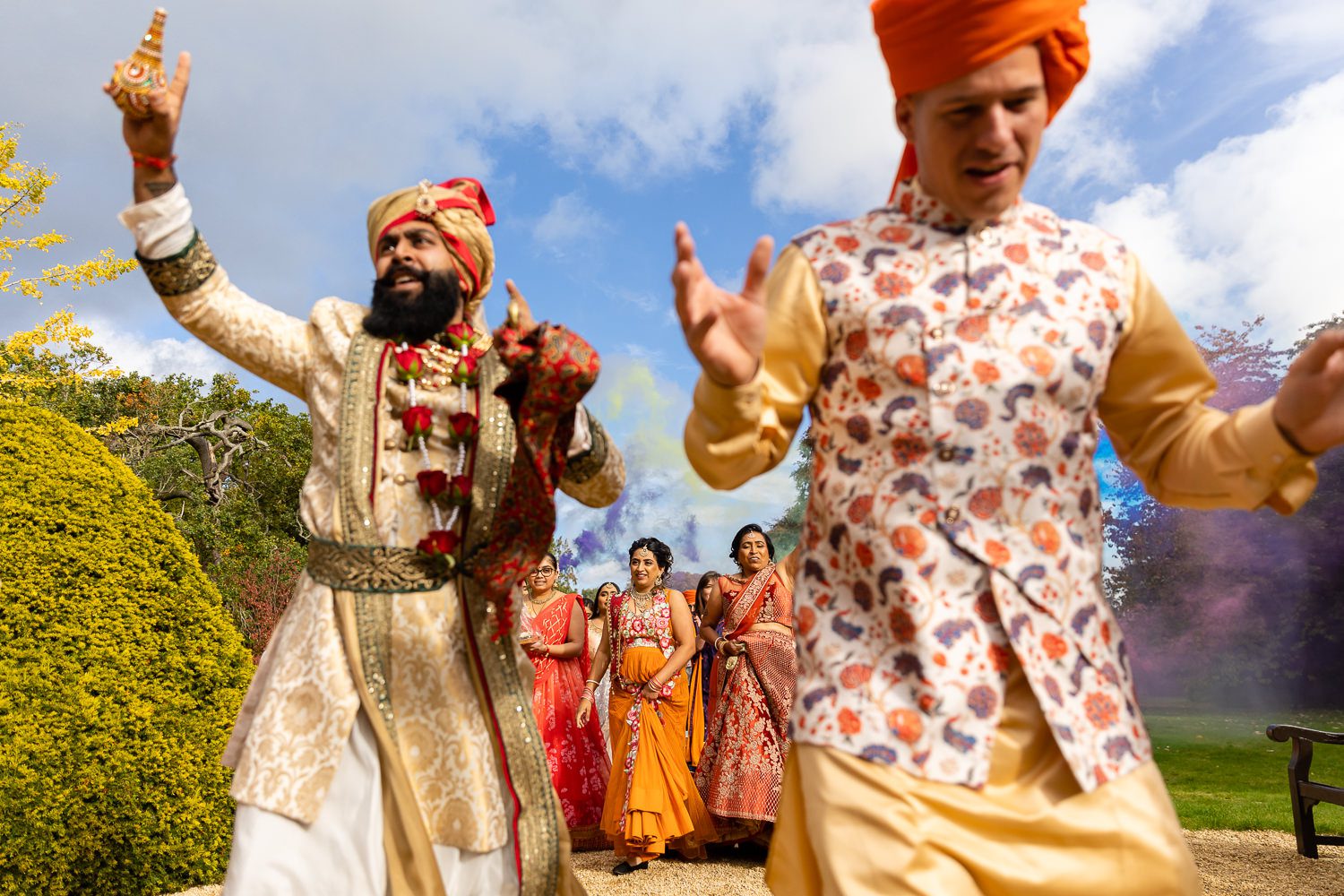 Asian wedding procession at Manor by the lake in Cheltenham