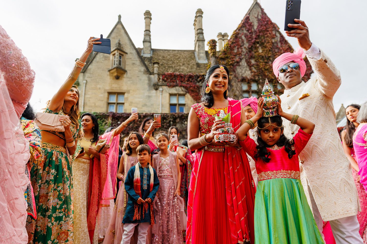 Asian wedding procession at Manor by the lake in Cheltenham